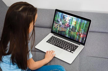Girl using Laptop with broken screen
