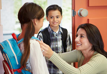 Mom getting kids ready for school